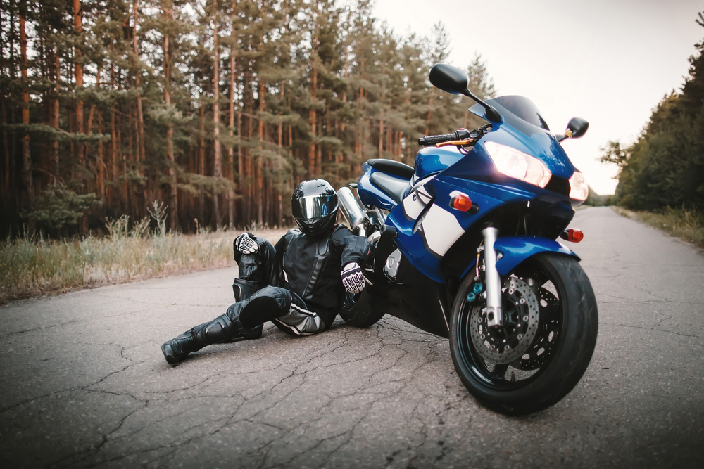 Motorcyclist,In,Leather,Outfit,And,A,Black,Helmet,Sits,On